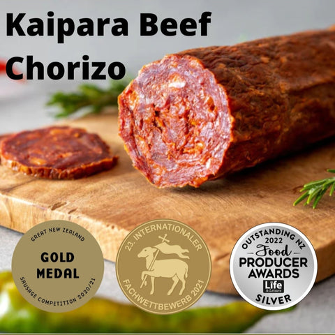 Kaipara Beef Chorizo on a wooden board with awards displayed.